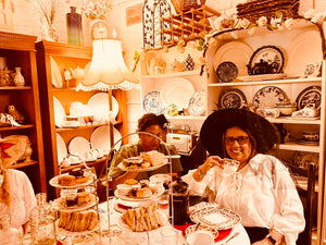 Alice in Wonderland and the Mad Hatter Tea Party.