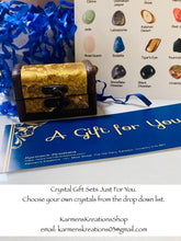 Load image into Gallery viewer, Treasure chest filled with crystals and a crystal chart.