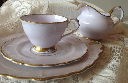 Paragon, a beautiful lilac and gold four piece tea set. Creamer, Tea Cup Trio set.